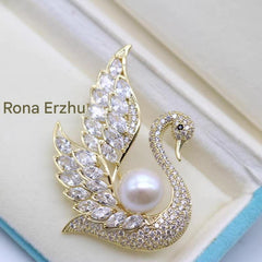 Swan pearl brooch with zirconia crystals image 1