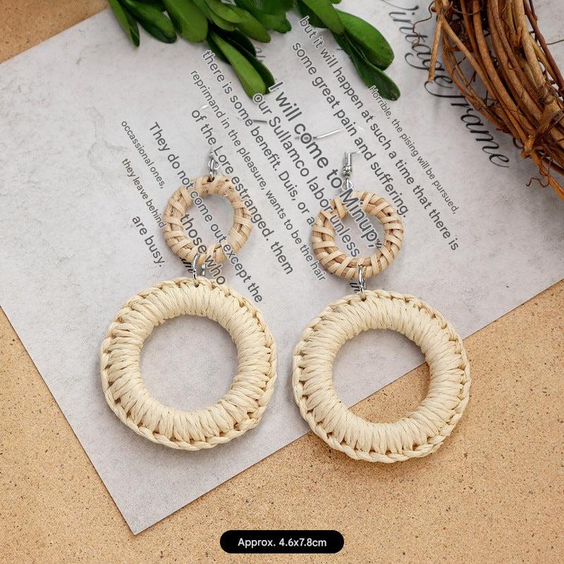 Unique woven earrings on a model