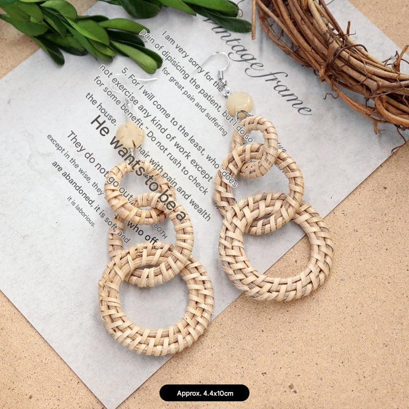 Unique woven earrings on a model