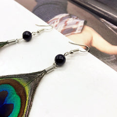 Dangle earrings worn by a model 1