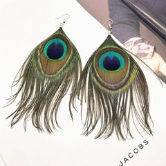 Tassel earrings displayed in beautiful setting 1