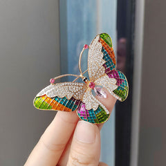Chic butterfly brooch against a white background