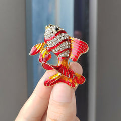 Casual outfit accessorised with fish brooch
