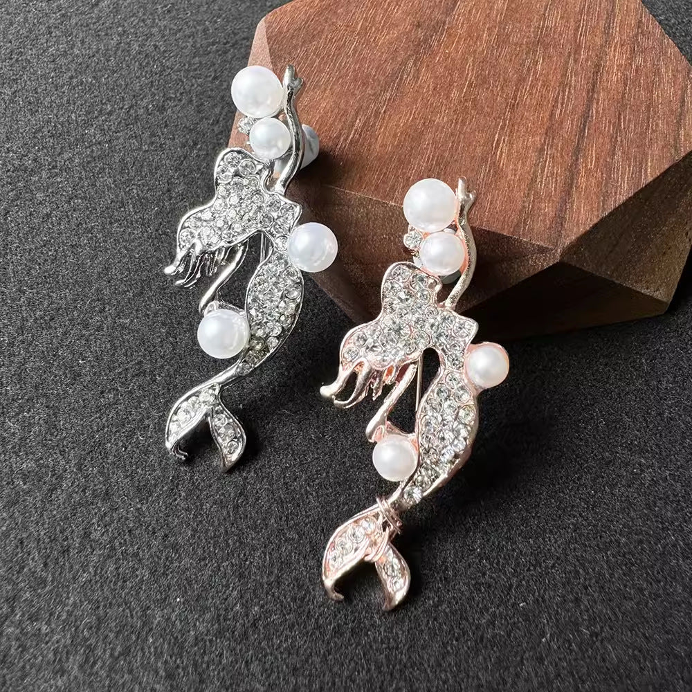 elegant pearl mermaid brooch on display