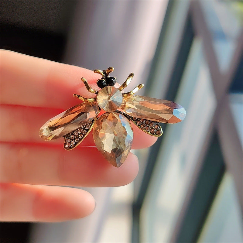 Durable acrylic bee brooch displayed on fabric image 5