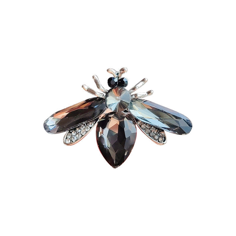 Durable acrylic bee brooch displayed on fabric image 5