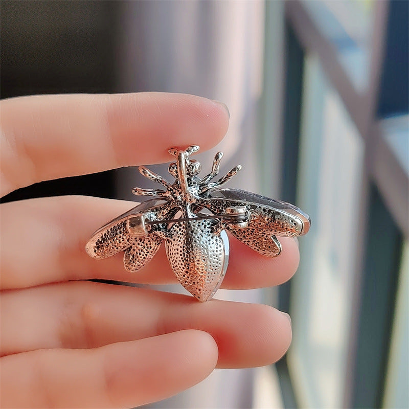 Charming bee pin styled with casual outfit image 9
