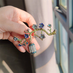 Elegant brooch placed on fabric background