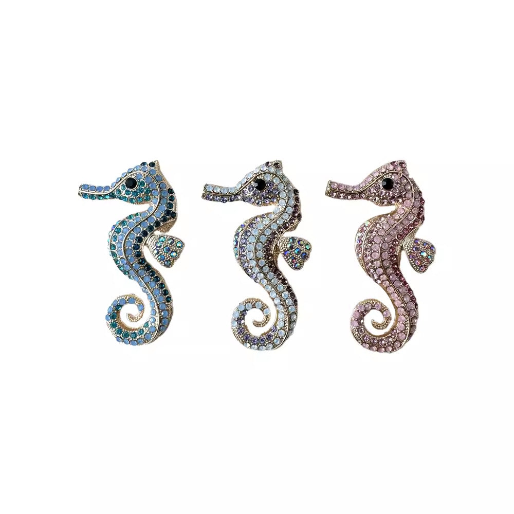 Chic sea horse pin against a white background