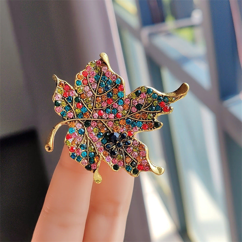 Vintage-inspired leaf brooch with colourful rhinestones