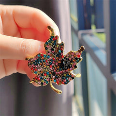 Stylish leaf brooch displayed on a sweater