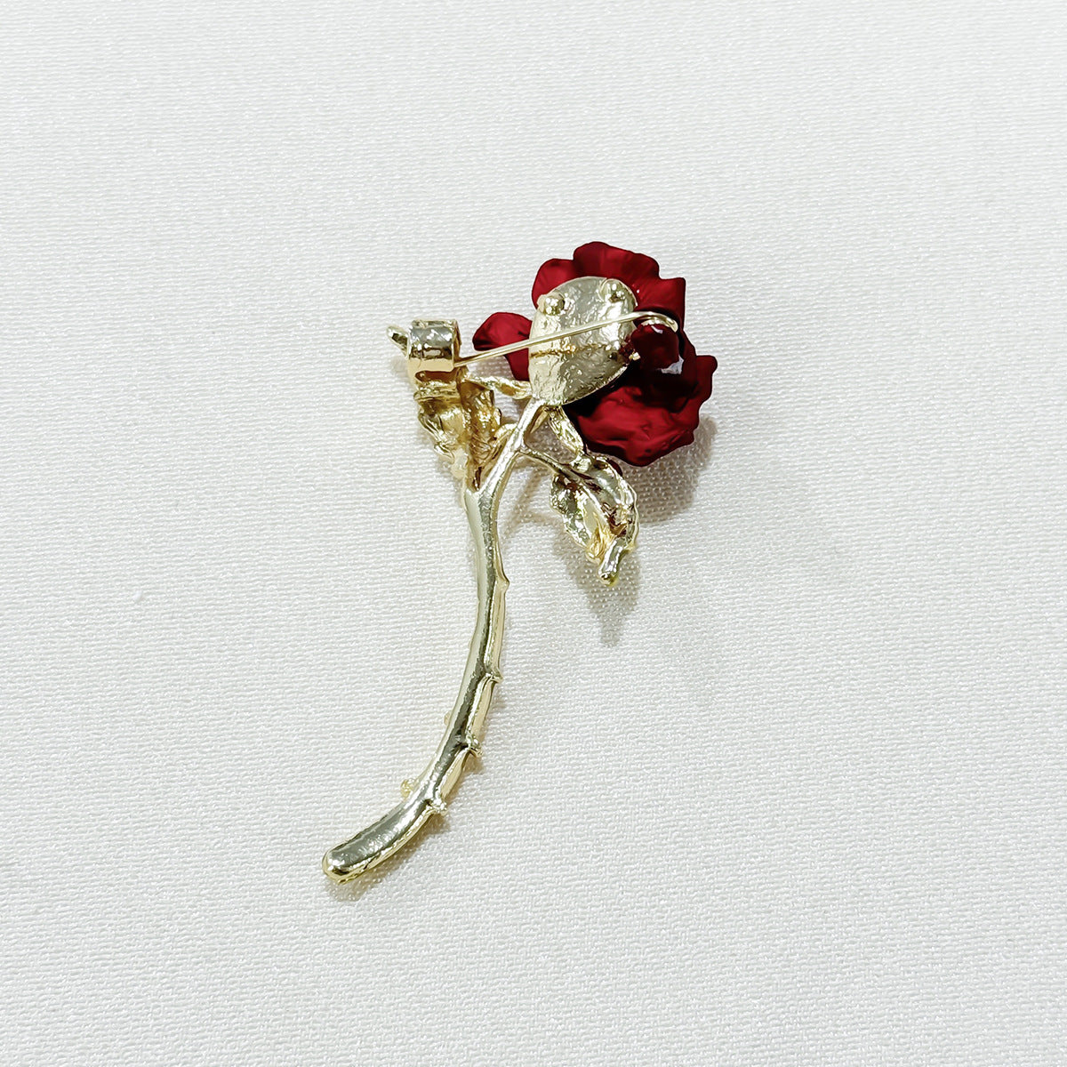 close-up of red rose brooch detail