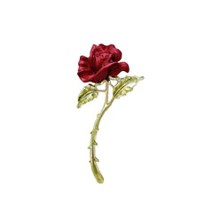 vibrant red rose brooch against bright background