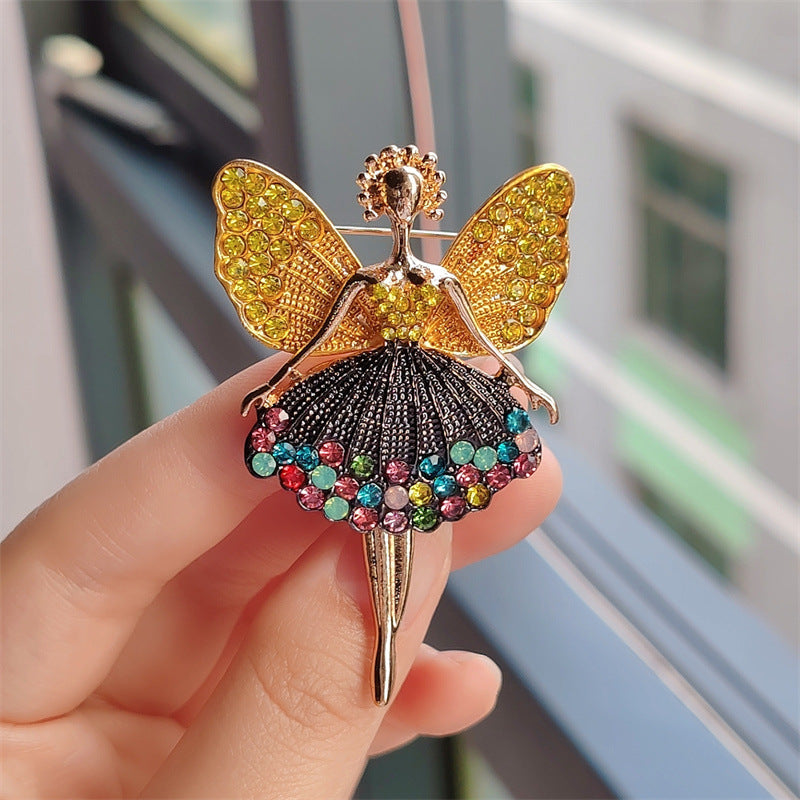 Flat lay of charming brooch with rhinestones