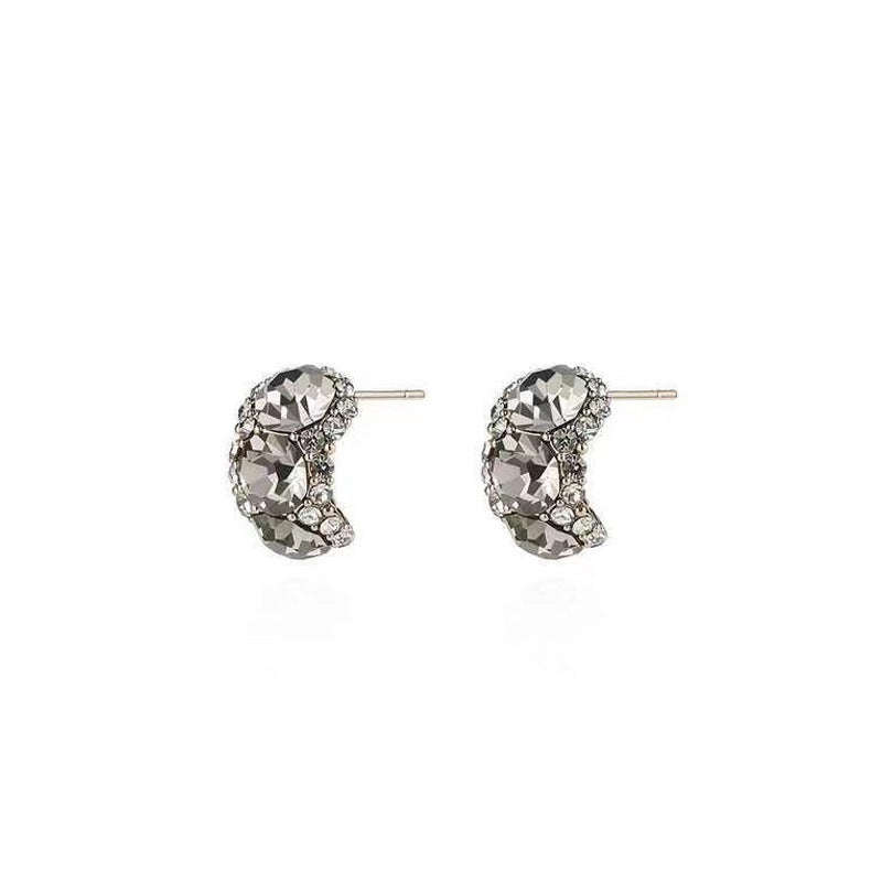 unique geometric earrings on a model