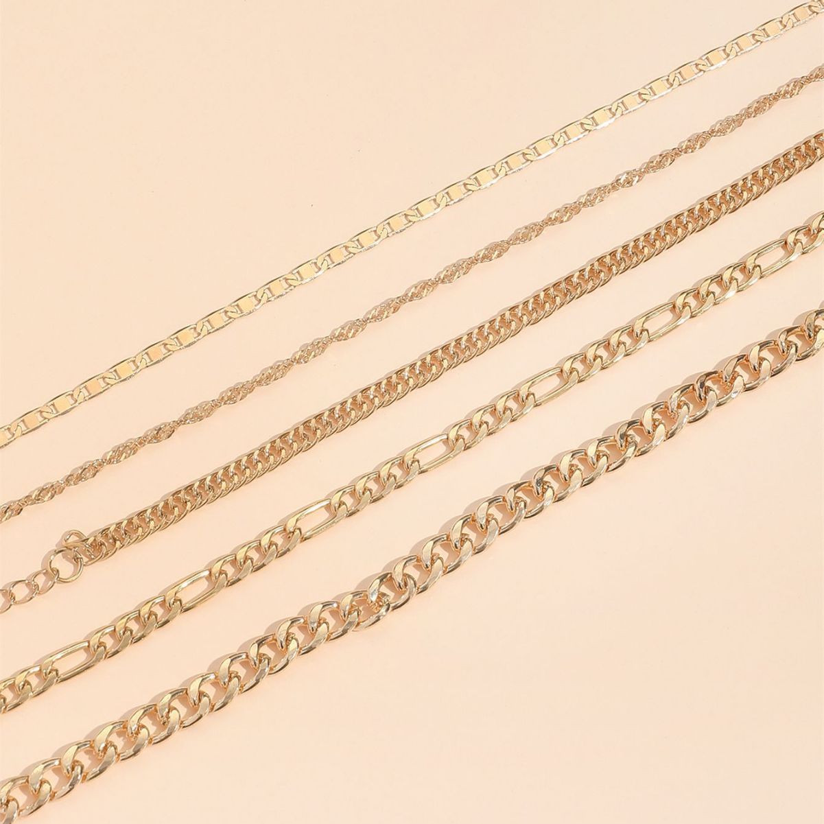 elegant metal anklets stacked