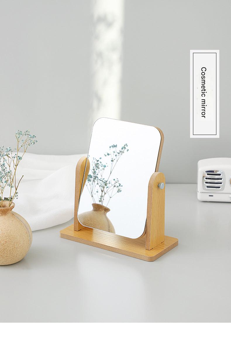 Compact wooden makeup mirror on desk